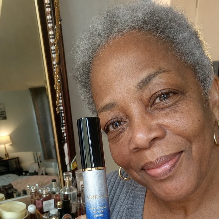 Denise holding Adirena Adirena Brow & Lash Serum