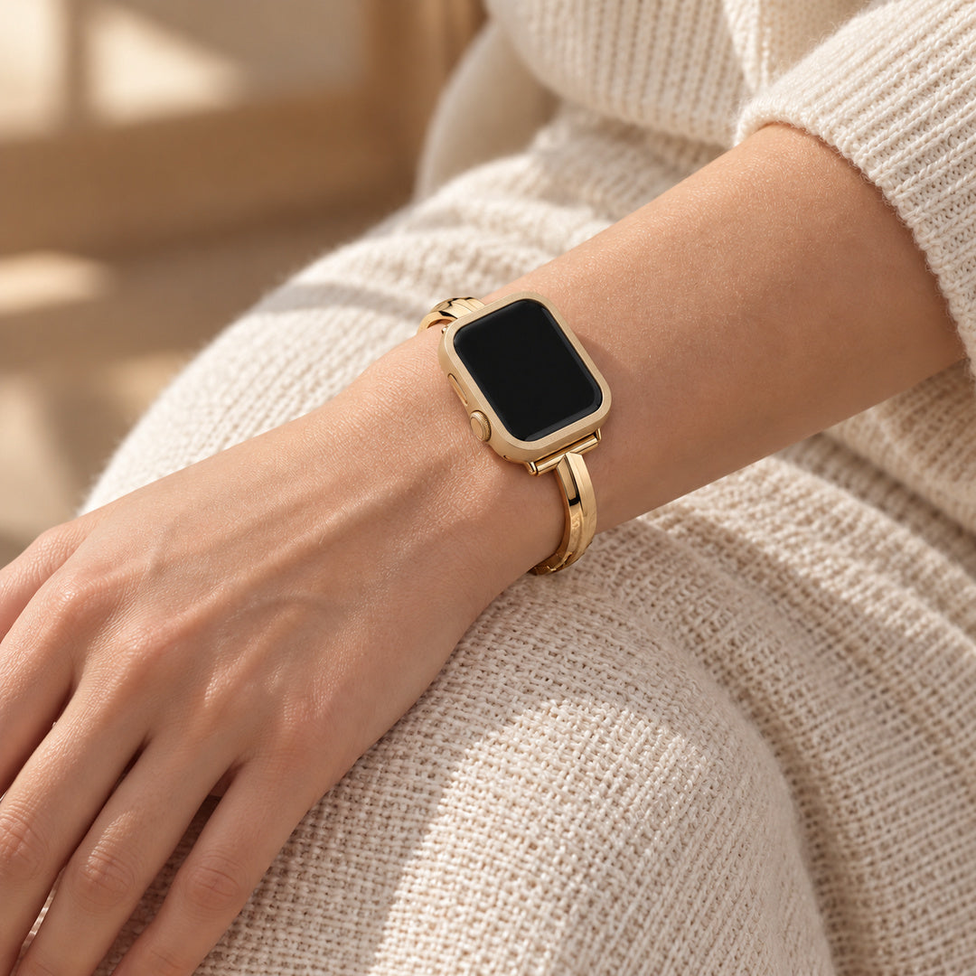 Halo gold case frame on a watch worn with a Madison gold band