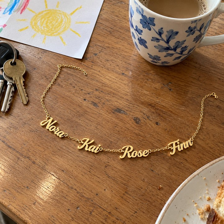 The gold name necklace laid on a table, everyday phone photo