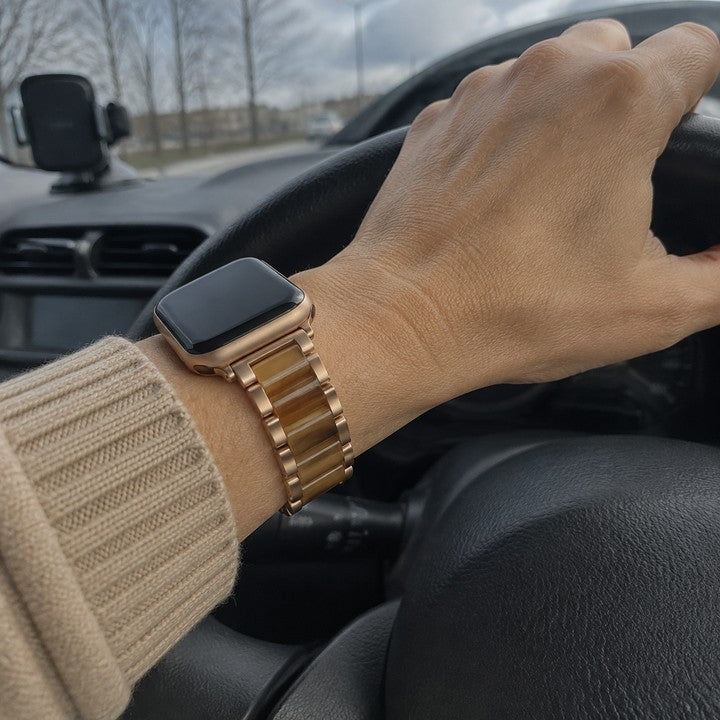 Erica wearing the Adirena Metal Resin Band for Apple Watch with her hands on the wheel