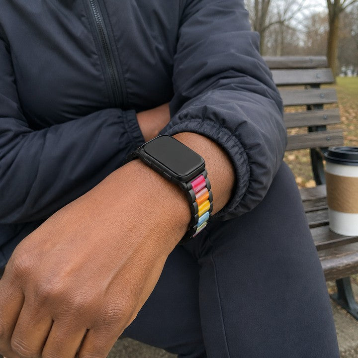 Carmen wearing the Adirena Metal Resin Band for Apple Watch on a bench outdoors