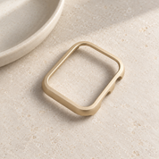 The Halo gold case frame on its own, showing its open front and side walls