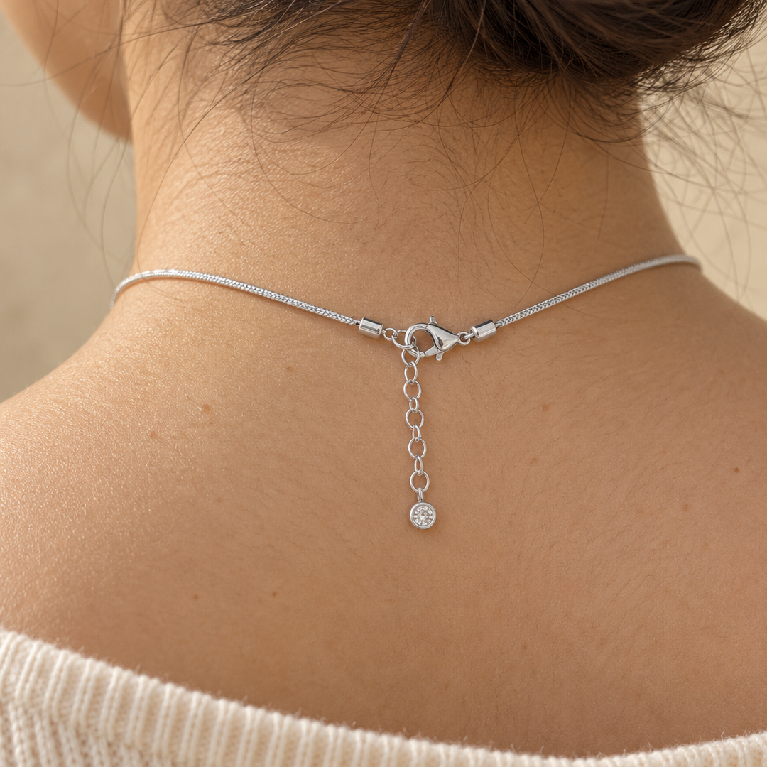 Cherie initial necklace fastened at the back of the neck with a lobster clasp and extender chain
