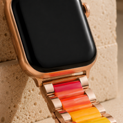 Close view of the Adirena Metal Resin Band's folding clasp and its Apple lug adapter with a steel release button