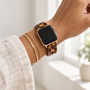Adirena Mosaic watch bands stacked with gold jewelry on a wrist