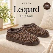 Aspen Thin Leopard slippers on a cream bench, with ASPEN, Leopard, Thin Sole and NEW COLOR text.