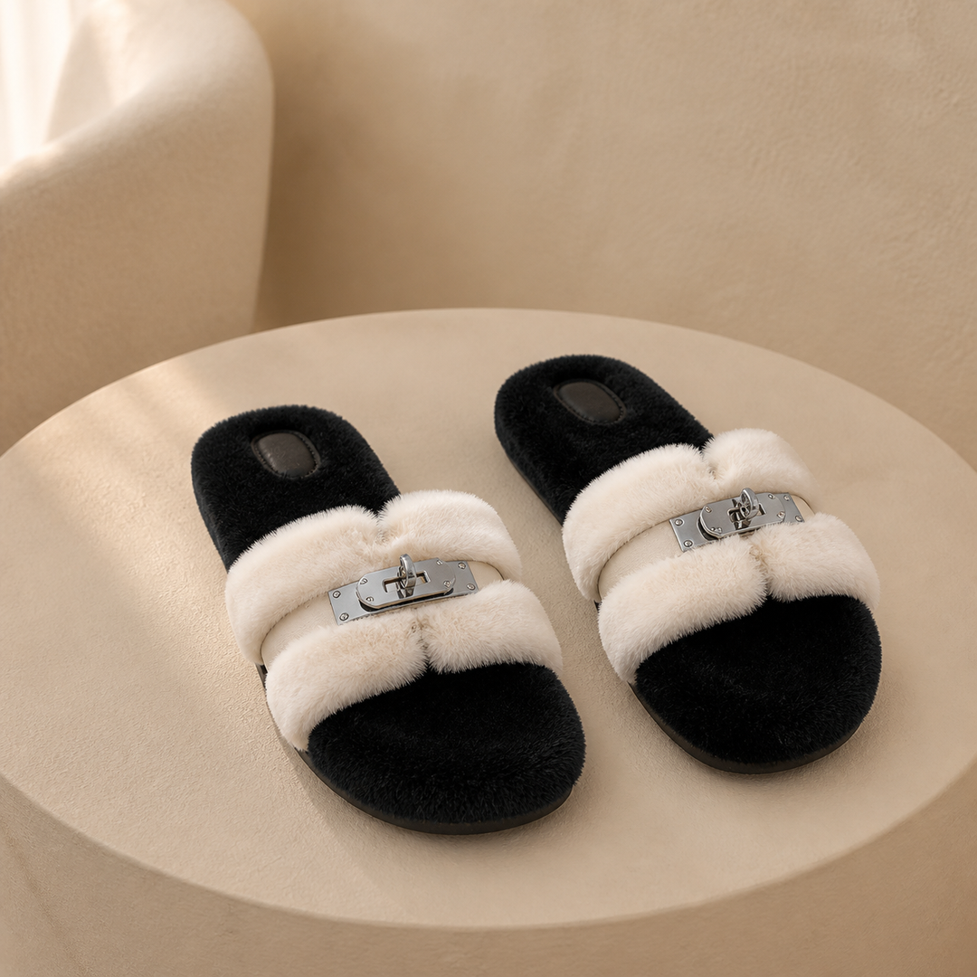 A pair of panda fur slippers on a warm plaster plinth