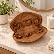 Empty Brown Clara showing its fold-down panel, fabric strips and gathered mesh pockets