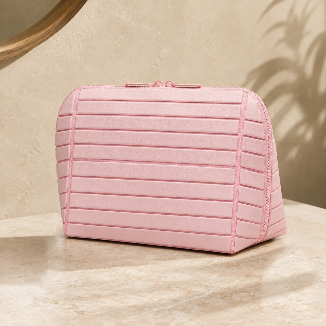 Closed pink Clara makeup bag viewed from the front