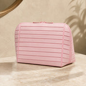 Closed pink Clara makeup bag viewed from the front