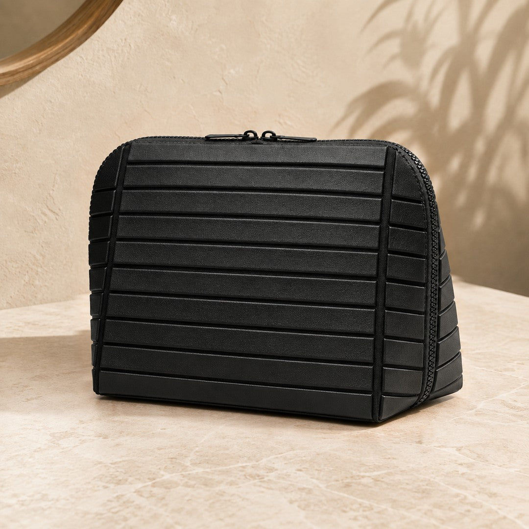 Closed black Clara makeup bag viewed from the front
