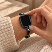 Fingers touching the seated Halo black case frame on a watch