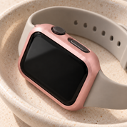Close-up of the Halo pink case frame's matte finish at the crown and side-button cut-outs