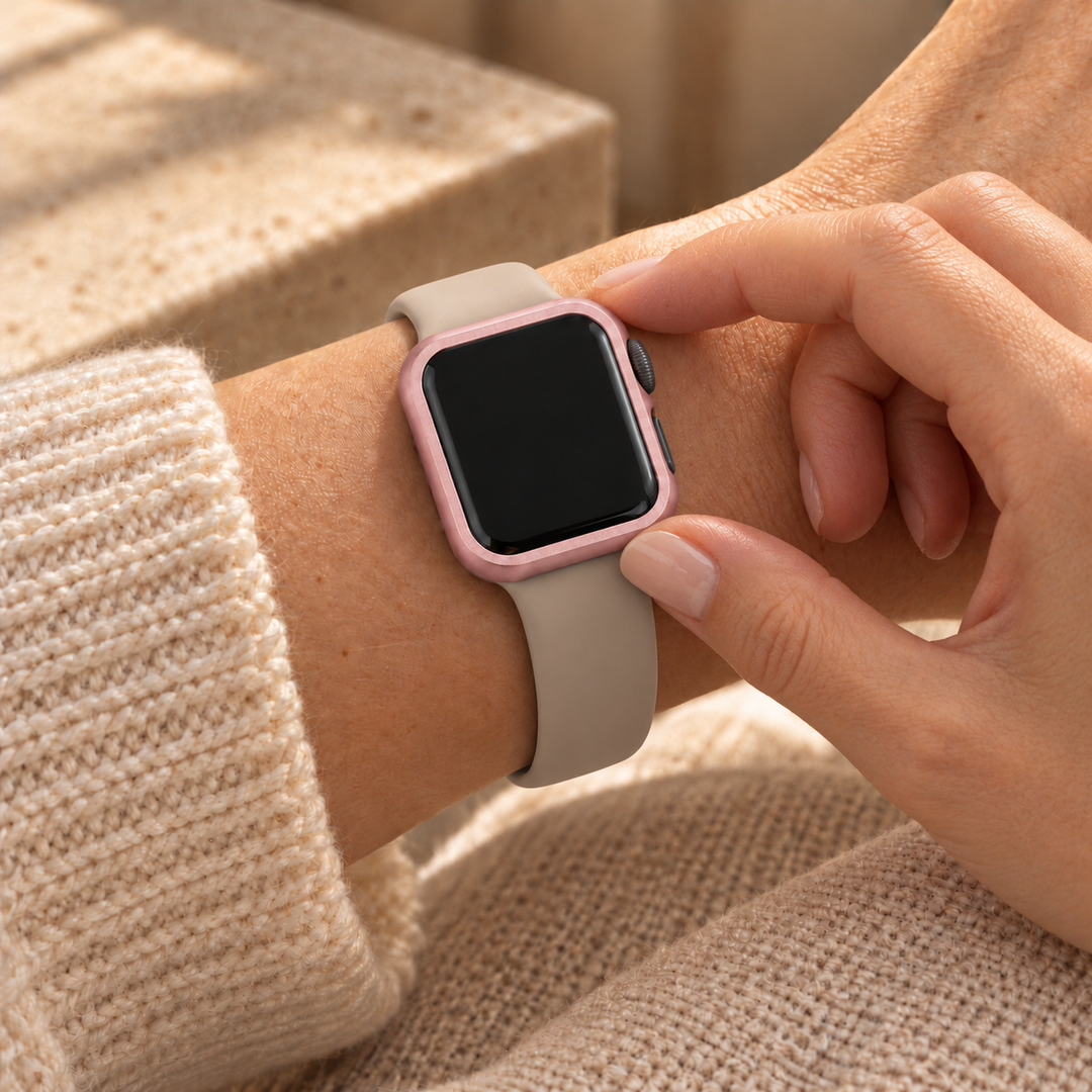 Fingers touching the seated Halo pink case frame on a watch