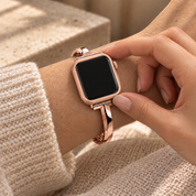 Fingers touching the seated Halo rose gold case frame on a watch