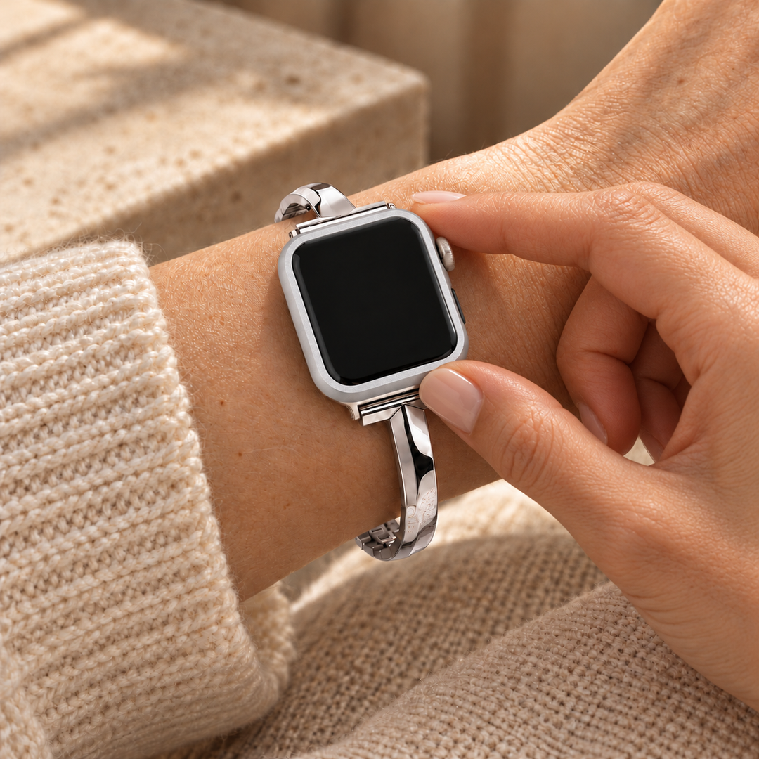 Fingers touching the seated Halo silver case frame on a watch