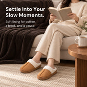 Chestnut Haven slippers worn while reading an open book beside a coffee table.