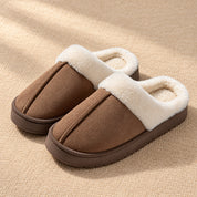 Coffee Haven slippers with a raised centre seam, white plush collar and low brown sole.