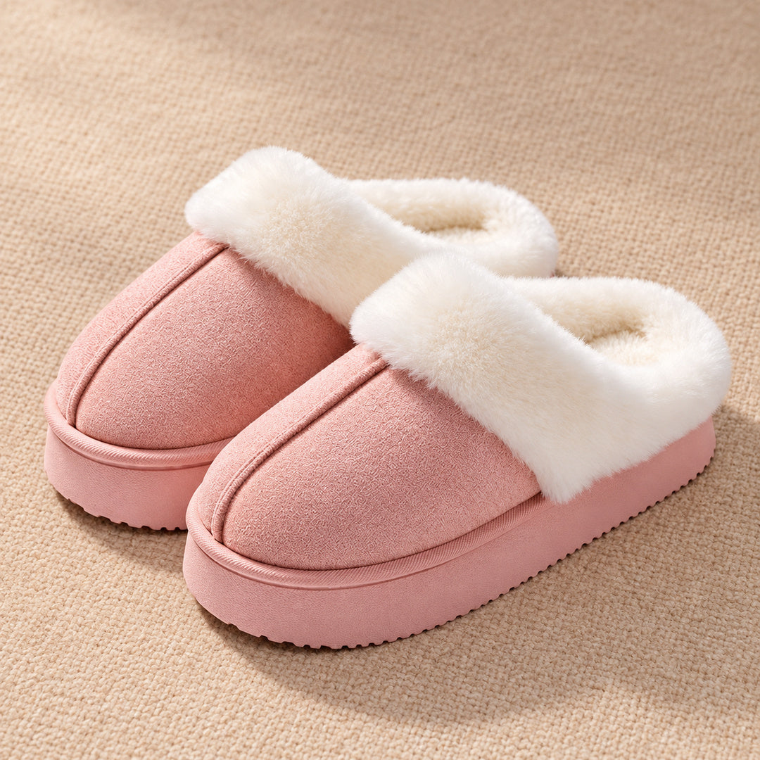 Blush Pink Haven slippers with a raised centre seam, white plush collar and low pink sole.