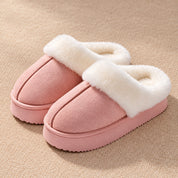 Blush Pink Haven slippers with a raised centre seam, white plush collar and low pink sole.