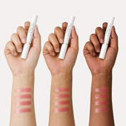 Lip stain swatches on three skin tones