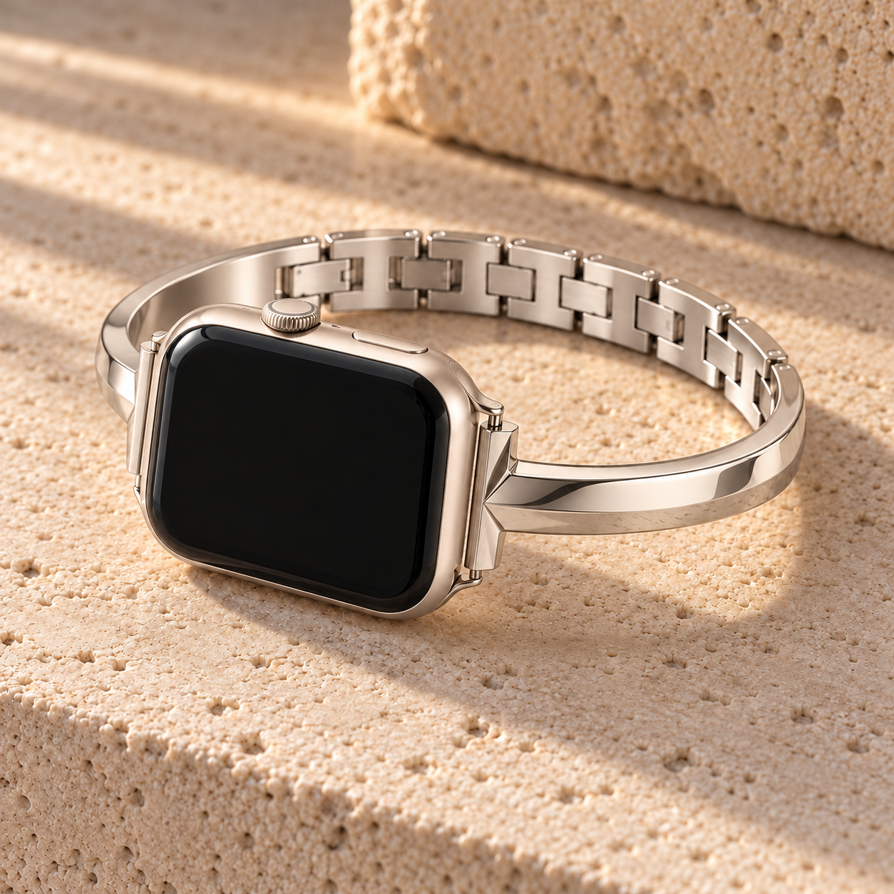 Dawngleam starlight watch band on a watch, resting on pale stone