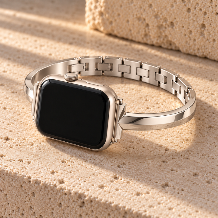 Dawngleam starlight watch band on a watch, resting on pale stone