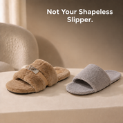 A taupe Marlow slipper beside a plain grey slipper, showing its structured turnlock design against a basic slide