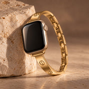 Milano gold watch band, complete band leaning on stone