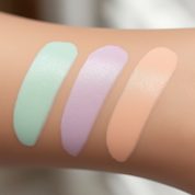Three pastel corrector swatches blending translucent