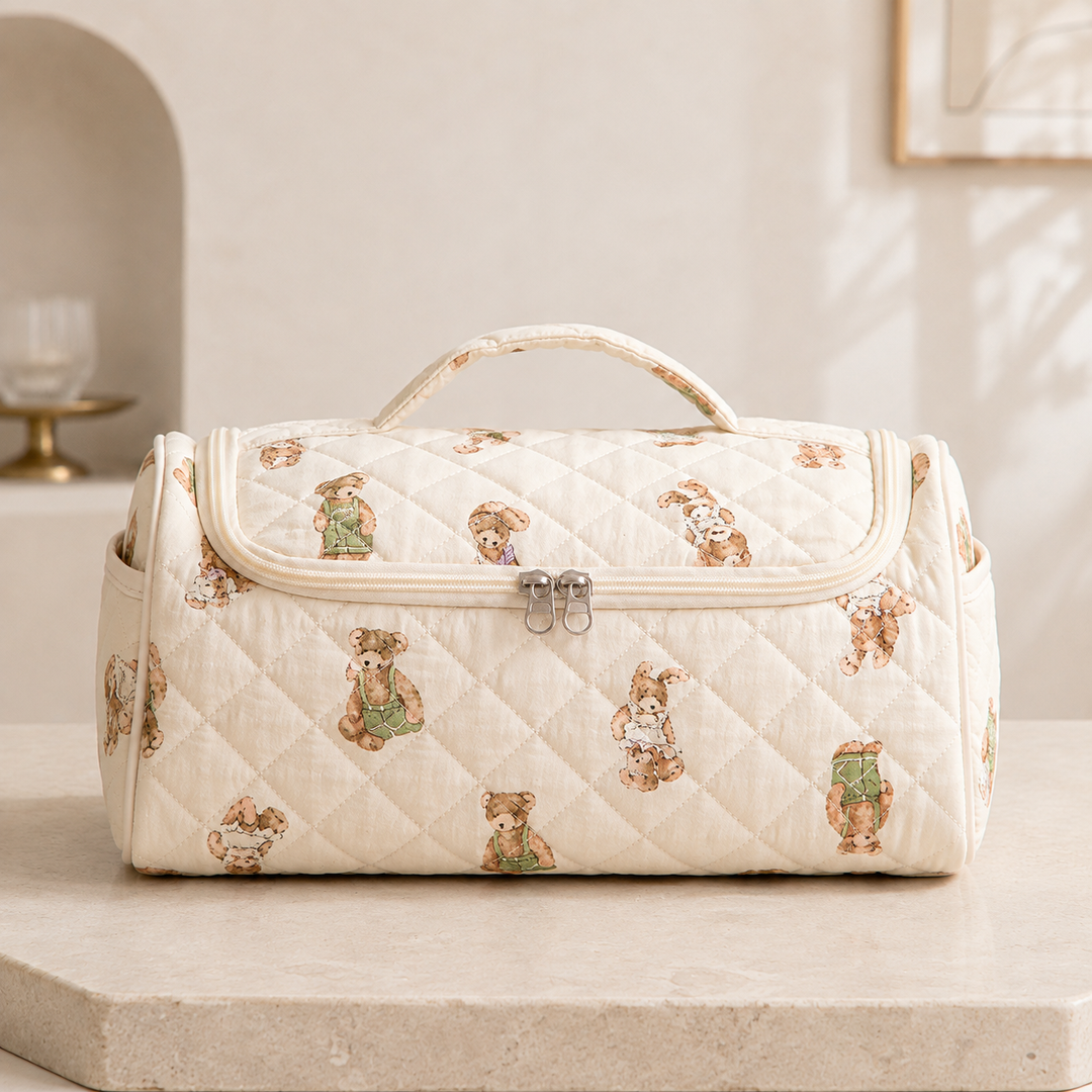 A quilted hair-tool case in the teddy pattern, closed and seen straight on