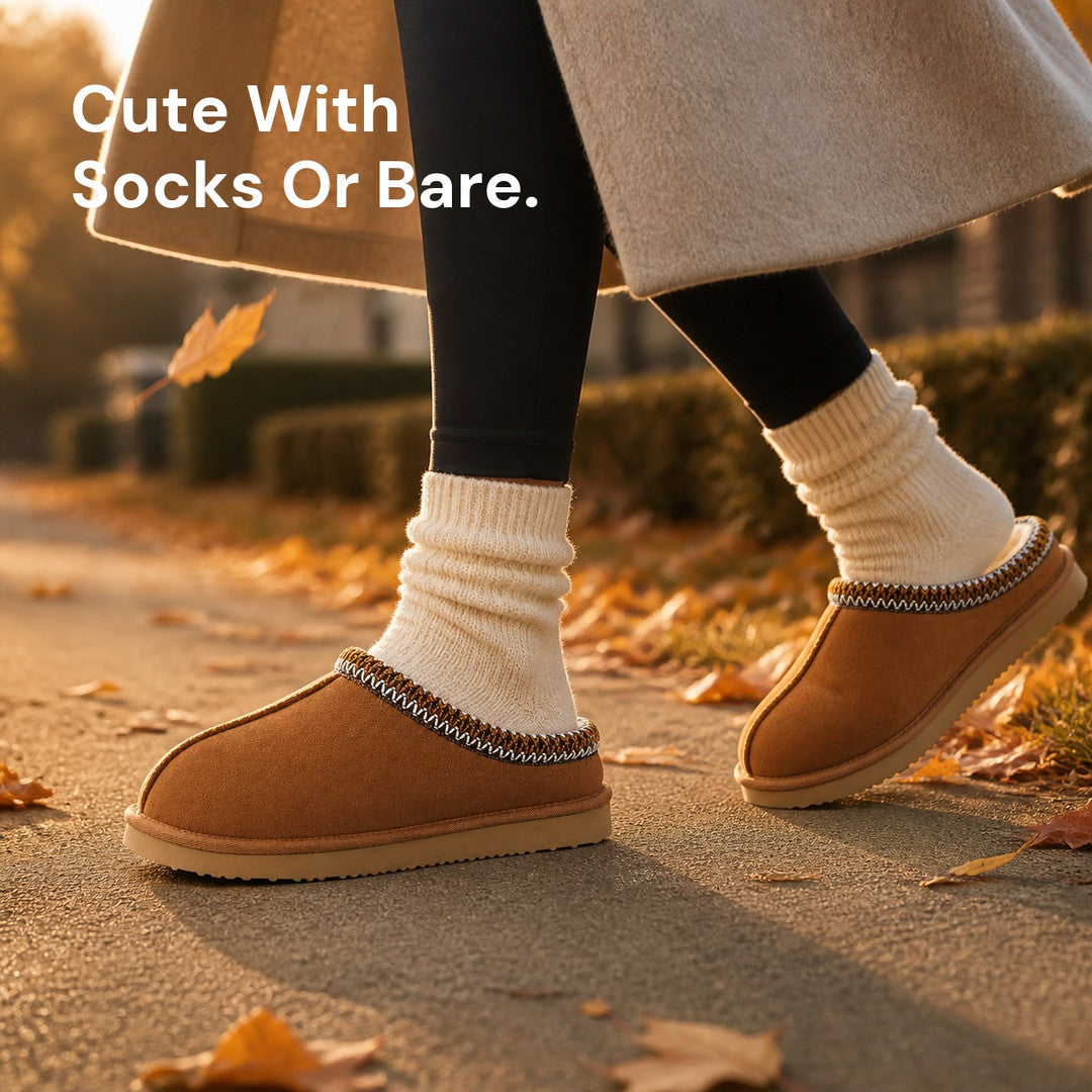 Chestnut slippers worn outdoors with cream slouch socks among autumn leaves
