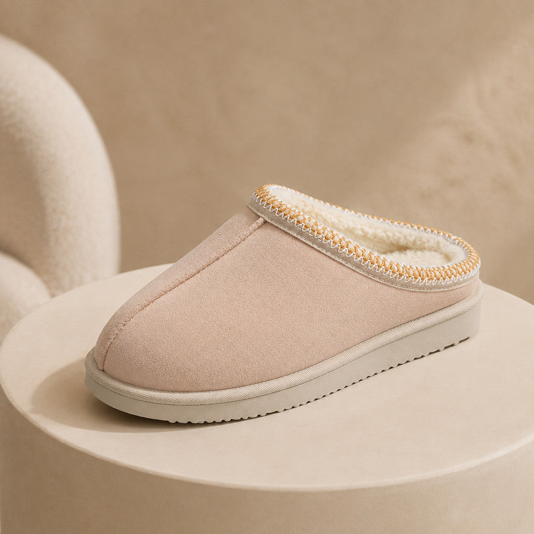 One sand slipper on a warm plaster plinth