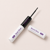 Adirena Lash Bond & Seal with the bond end open and its black micro brush withdrawn