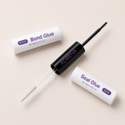 Adirena Lash Bond & Seal with both ends open, black brush and clear spoolie visible