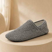 A pair of grey barefoot travel slipper socks side by side