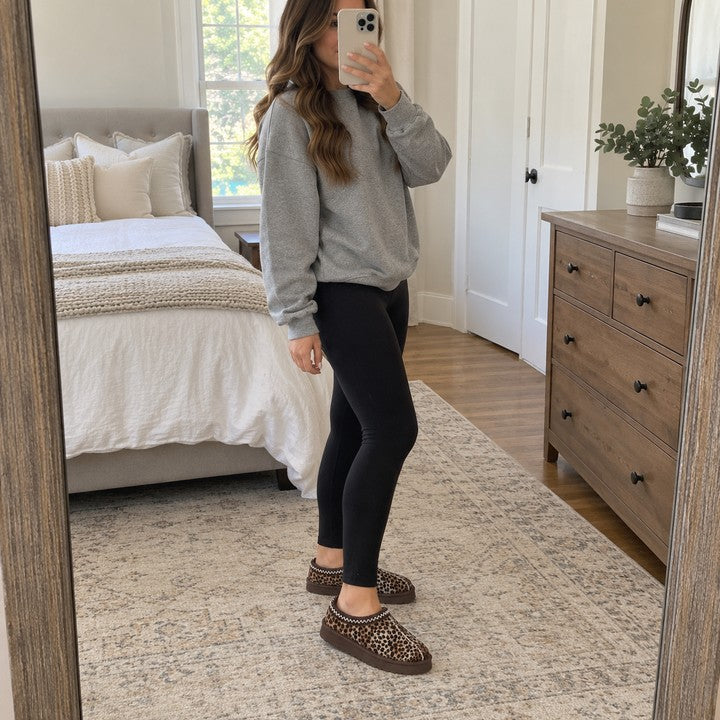 Illustrative standing mirror selfie wearing Thin Leopard Aspen slippers.