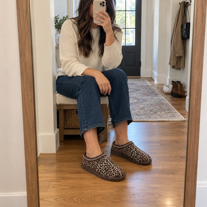 Illustrative seated hallway mirror selfie wearing Thin Leopard Aspen slippers.