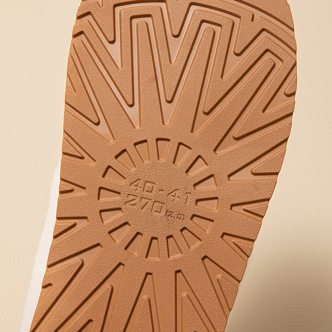 Close view of the textured central and forefoot tread on a Haven slipper's molded sole.