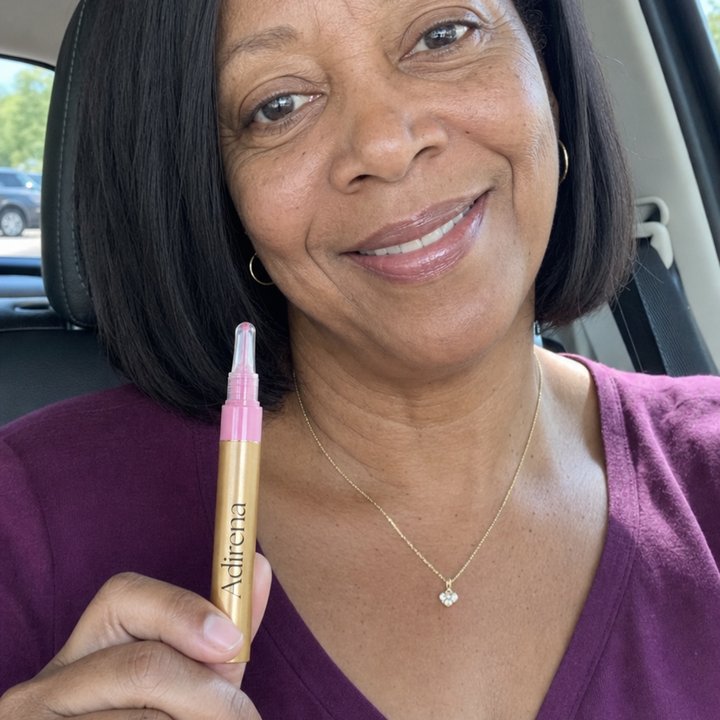 Yolanda holding Adirena Hydrating Lip Plumper