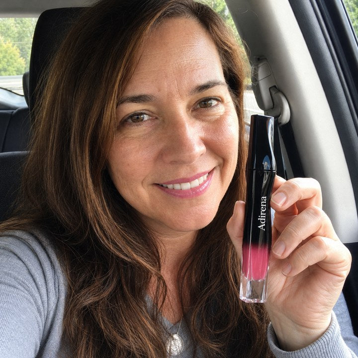 Sarah holding Adirena Stellar Dust™ Lip Stain