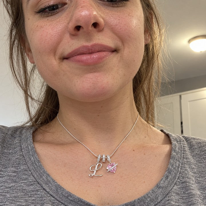 A woman wearing the silver Cherie initial necklace, everyday phone photo