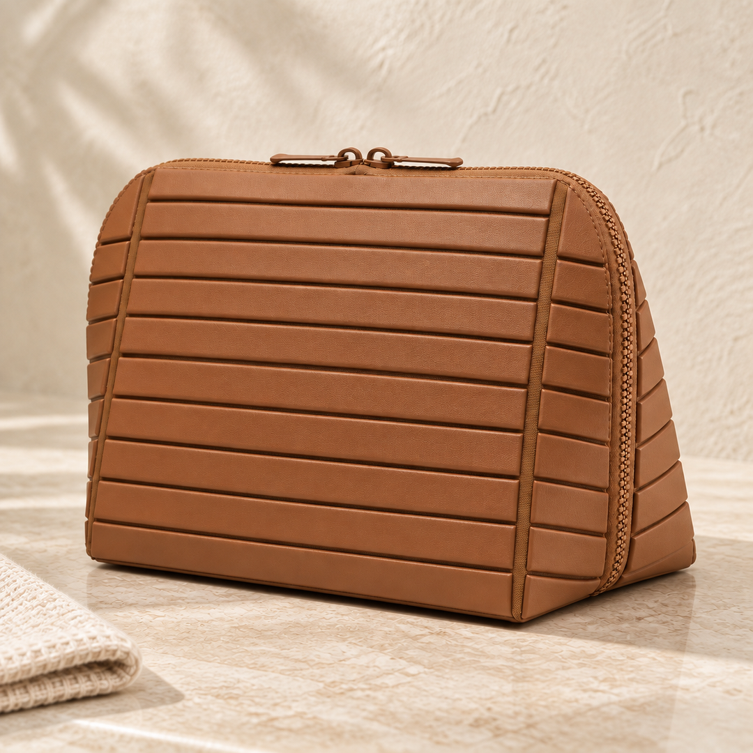 Closed Brown Clara showing its raised bands, tonal trim and triangular side on a stone counter