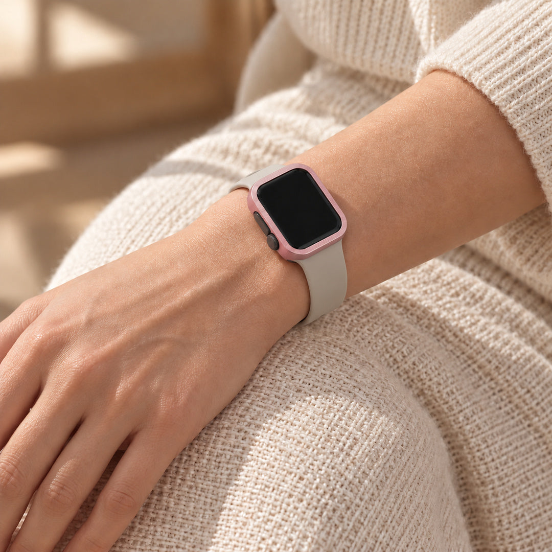 Halo pink case frame on a watch worn with a plain neutral band