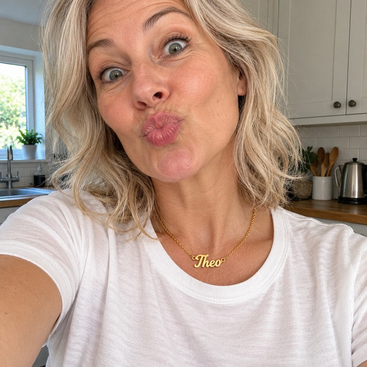 A woman wearing the gold name necklace, everyday phone photo