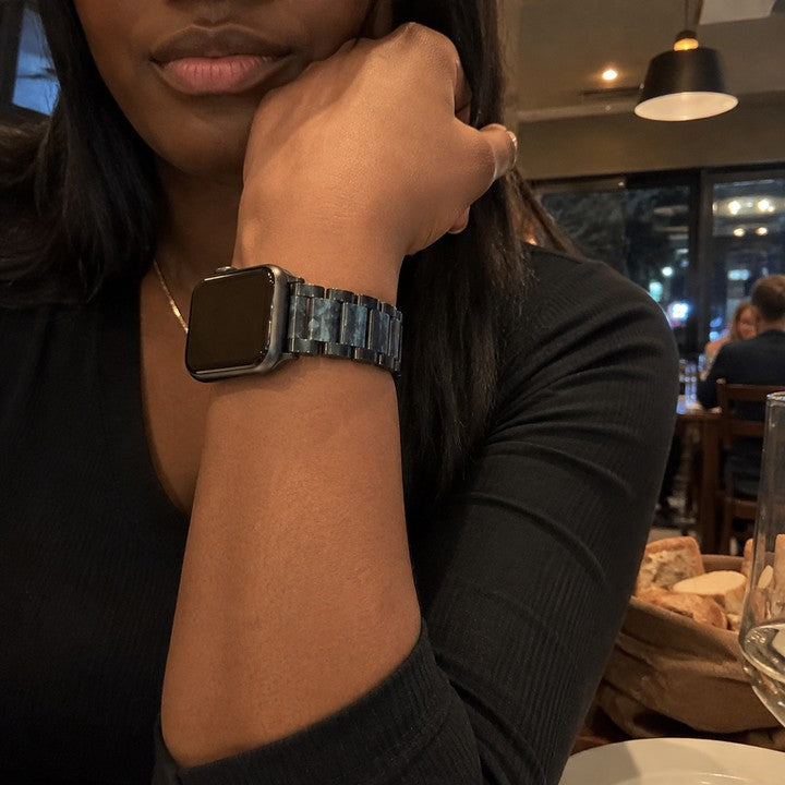 Michelle wearing the Adirena Metal Resin Band for Apple Watch at a restaurant table