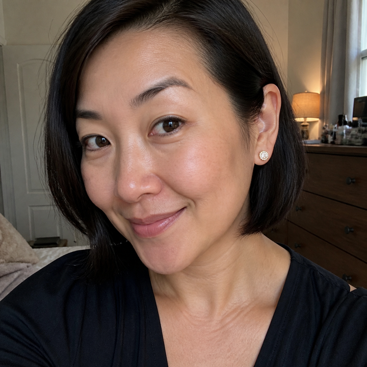 Woman wearing halo studs with a dressed-up look
